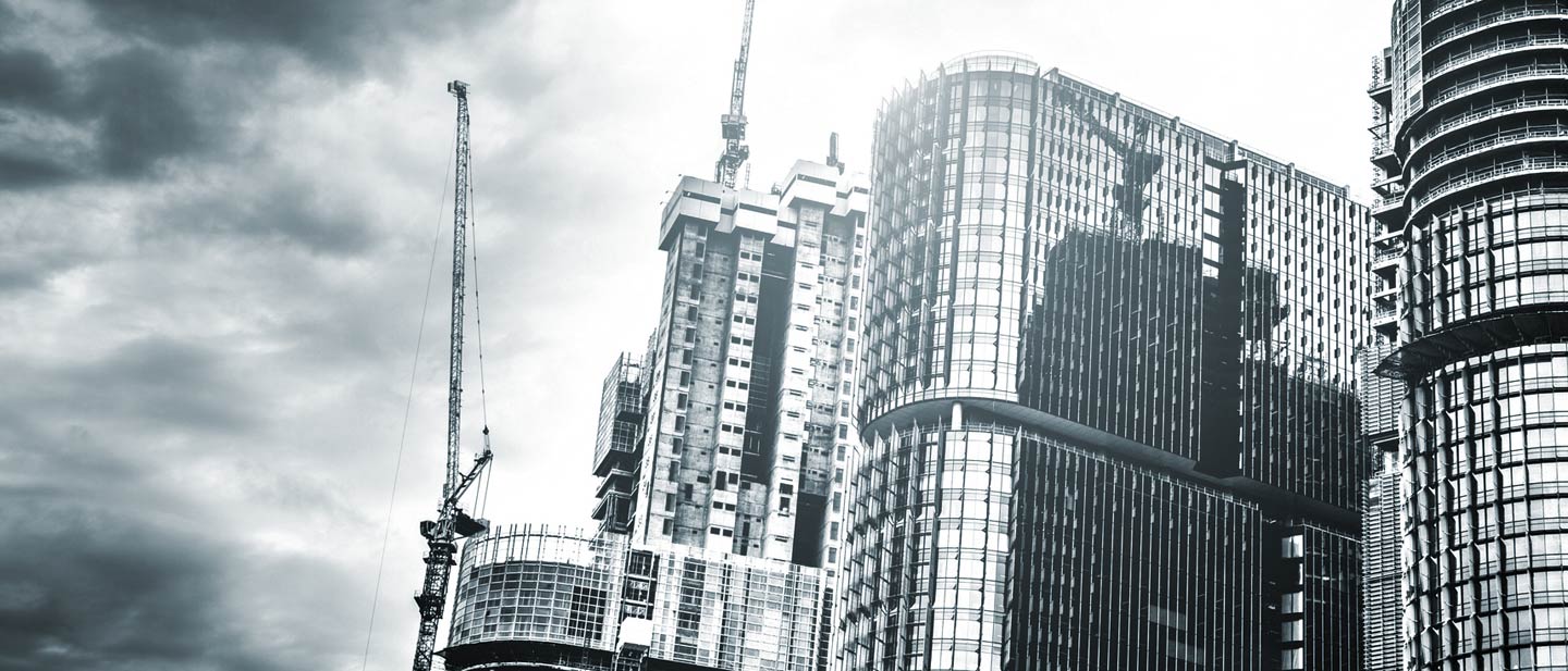 Commercial city buildings with cranes